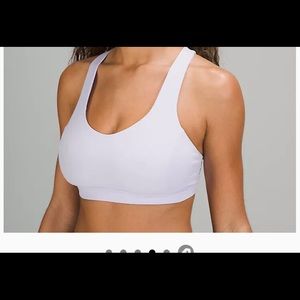NWT Lululemon sports bra. Coverage for C/D cup up front and a strappy open back.